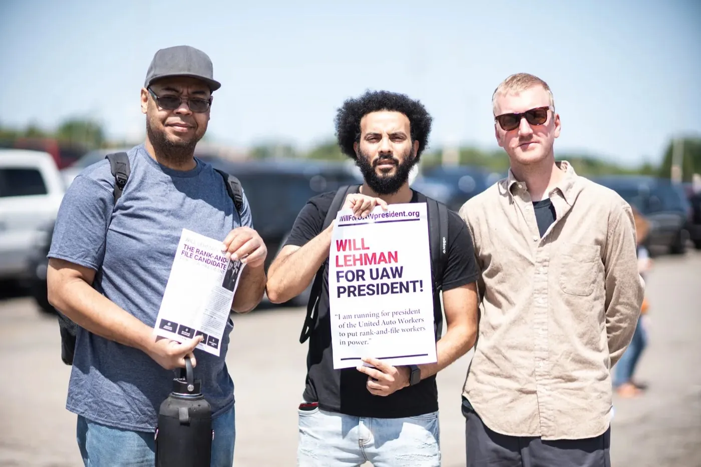 Will Lehman with two autoworkers holding Will Lehman for UAW President leaflets