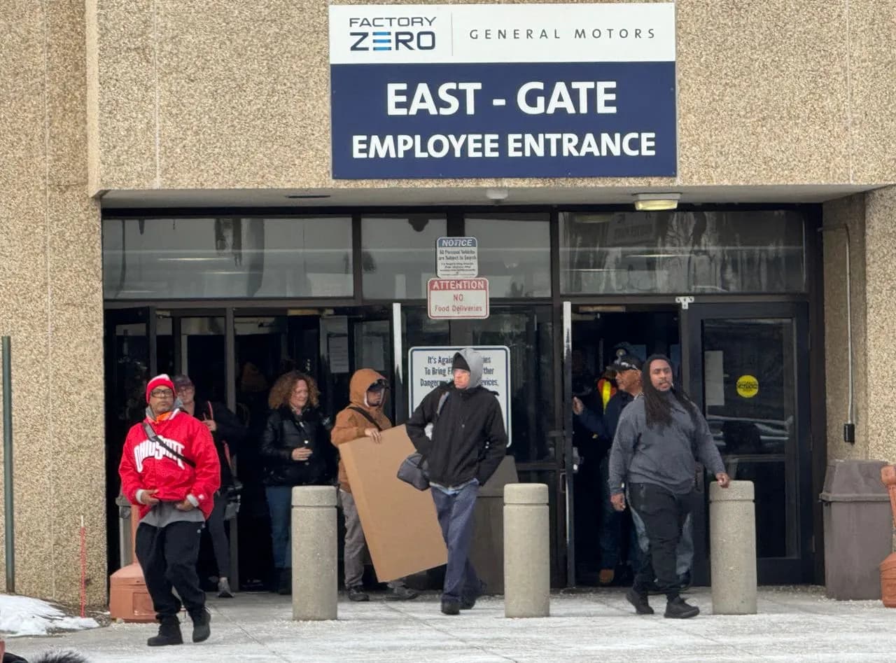 Workers leaving the Factory Zero East Gate employee entrance at General Motors in Detroit