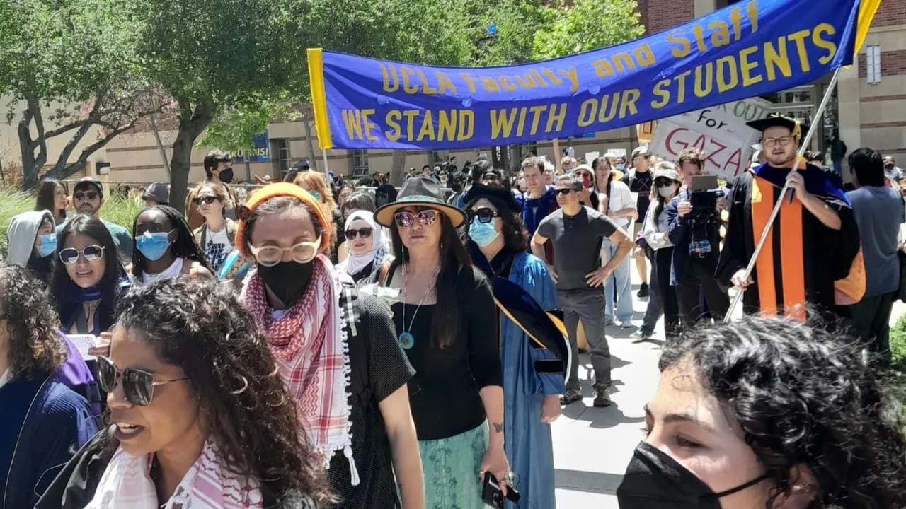 Students and teachers march together at the University of California-Los Angeles, April 29, 2024