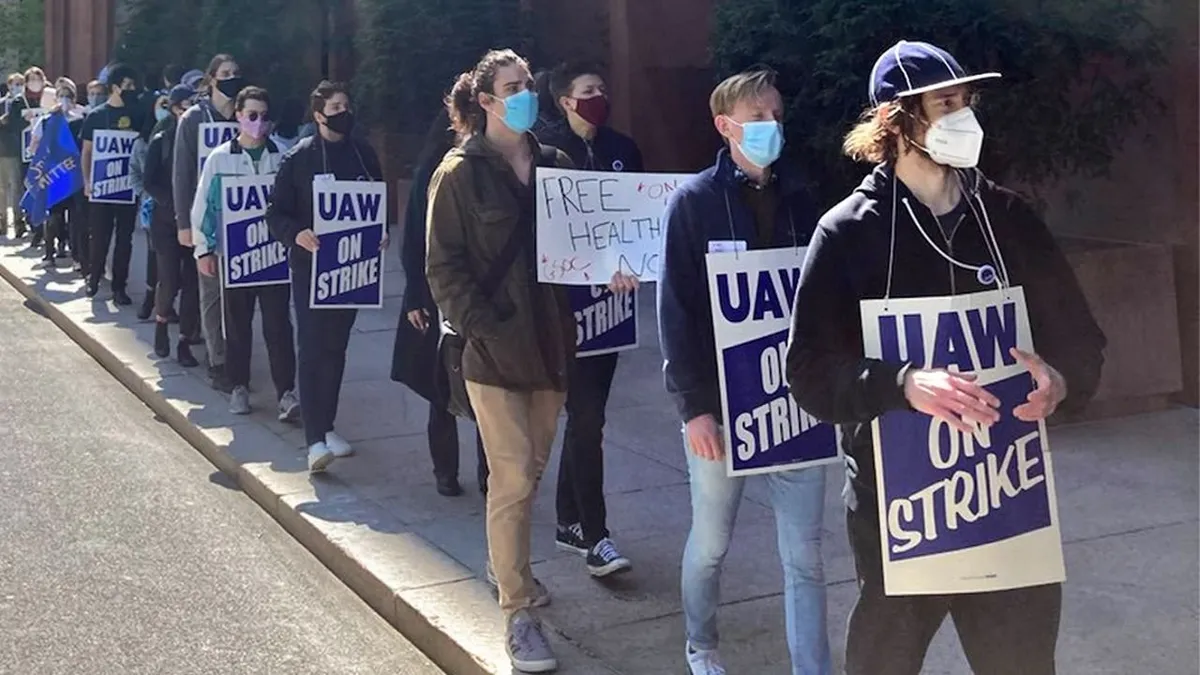 NYU academic workers picketing outside a university building